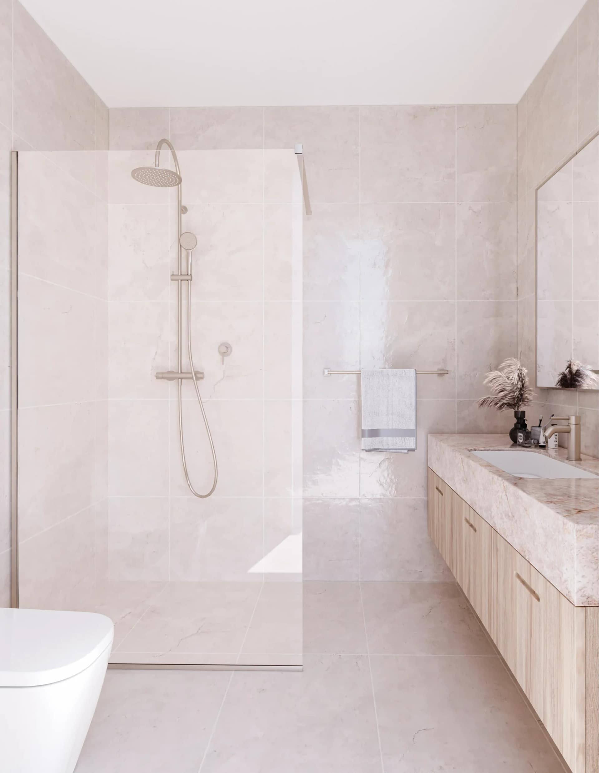 Bathroom wrapped in honed Tundra stone tiles with a stone-topped oak vanity and satin nickel tapware